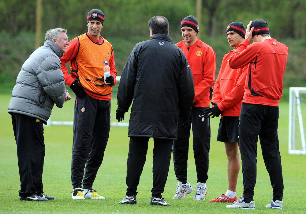 A coach talking with players in a training session